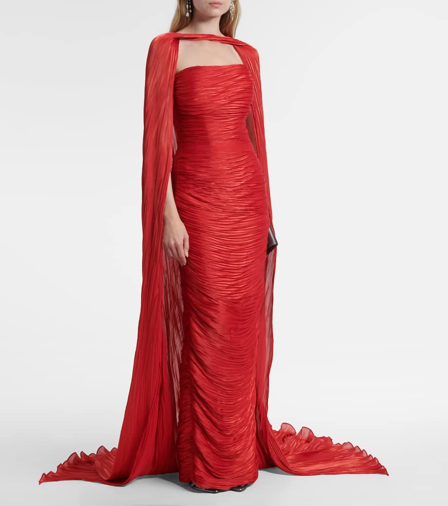 Caped pleated bustier gown