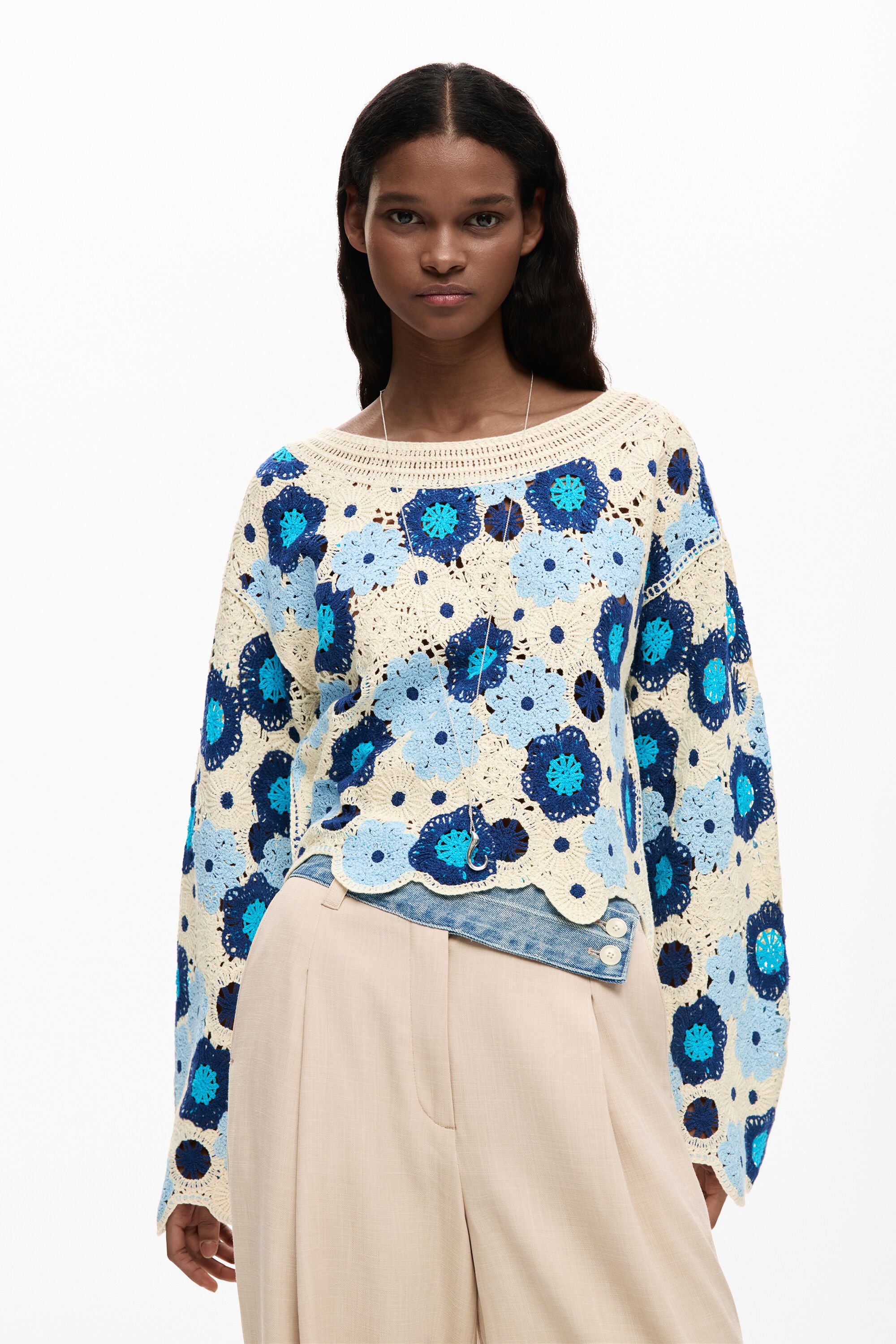 Crochet sweater with flower