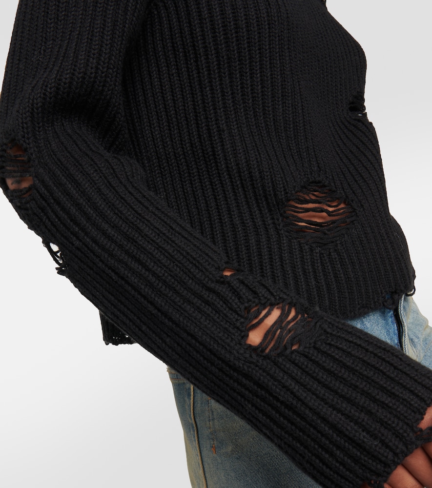 Distressed cotton and wool sweater