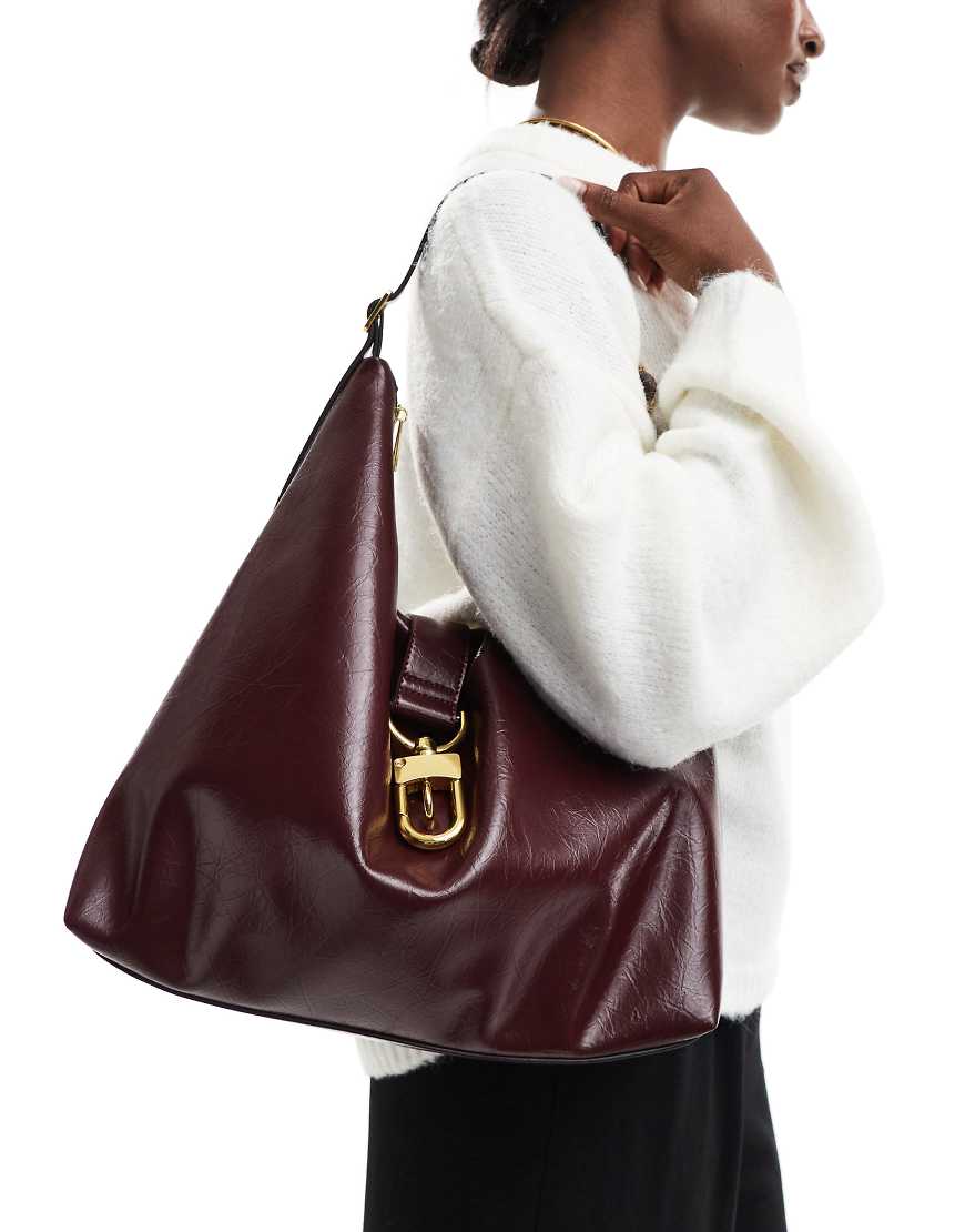 ASOS DESIGN statement buckle slouchy tote bag in burgundy-Red