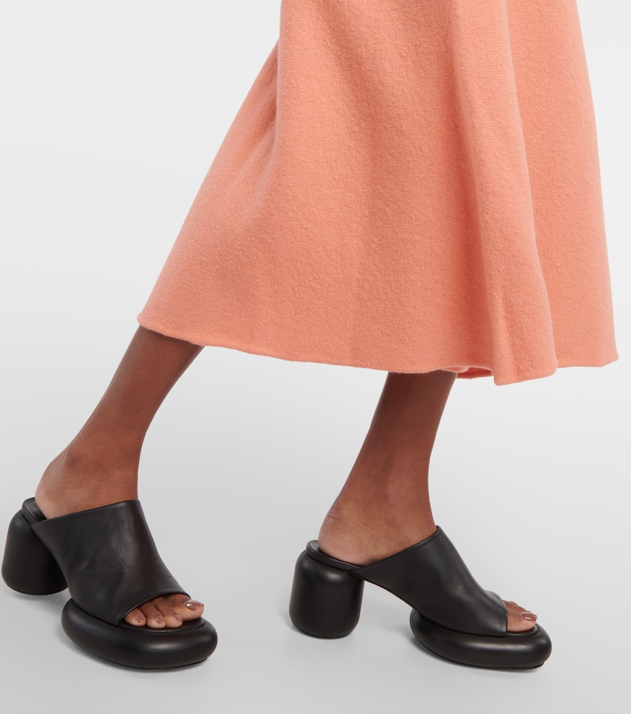 High-rise asymmetric wool midi skirt