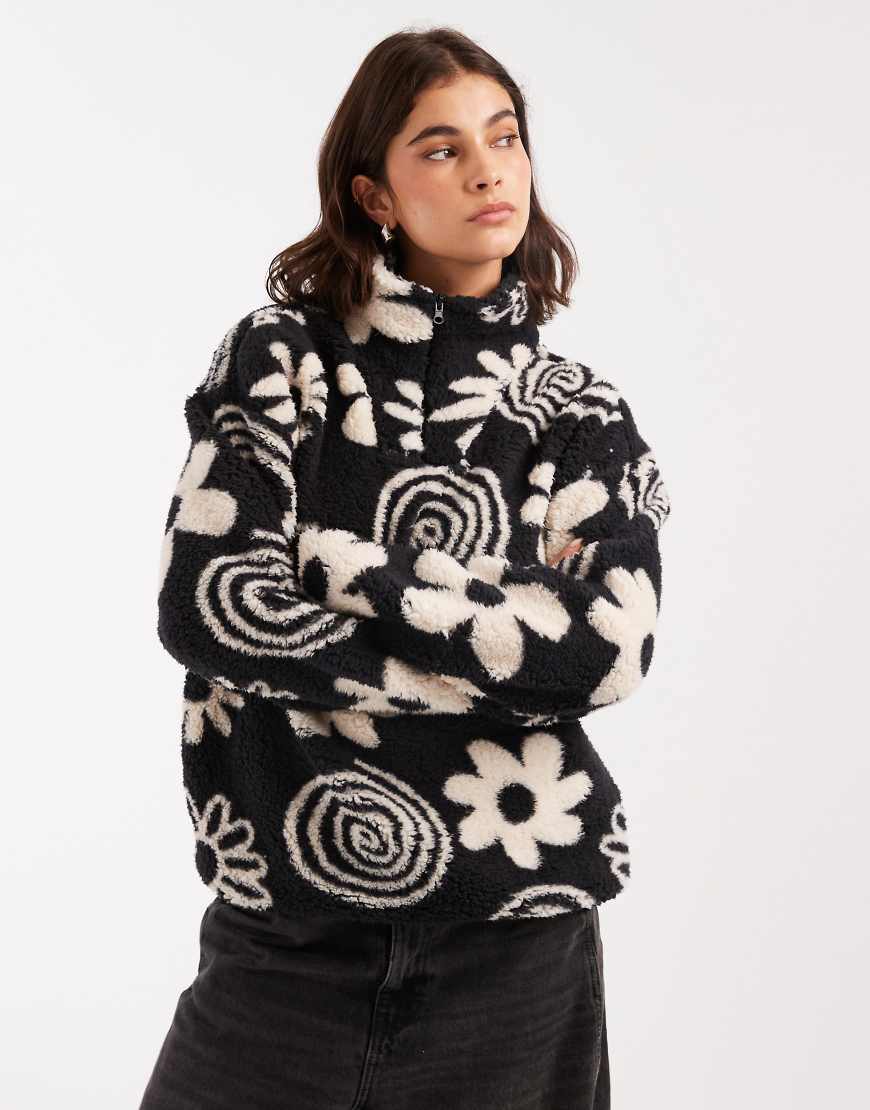 Flower print 3/4 zip fleece in black and cream