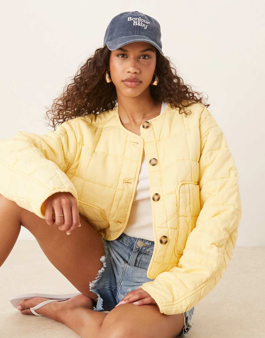 Cropped collarless quilted jacket in lemon-Yellow