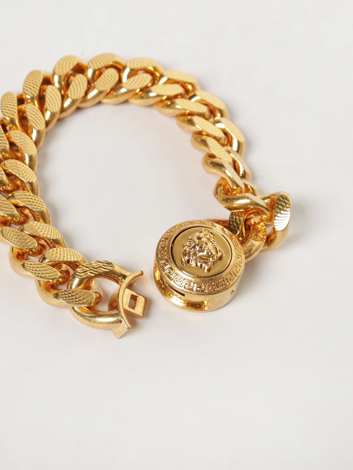 Gold-Tone Metal Bracelet with Embossed Medusa Detail