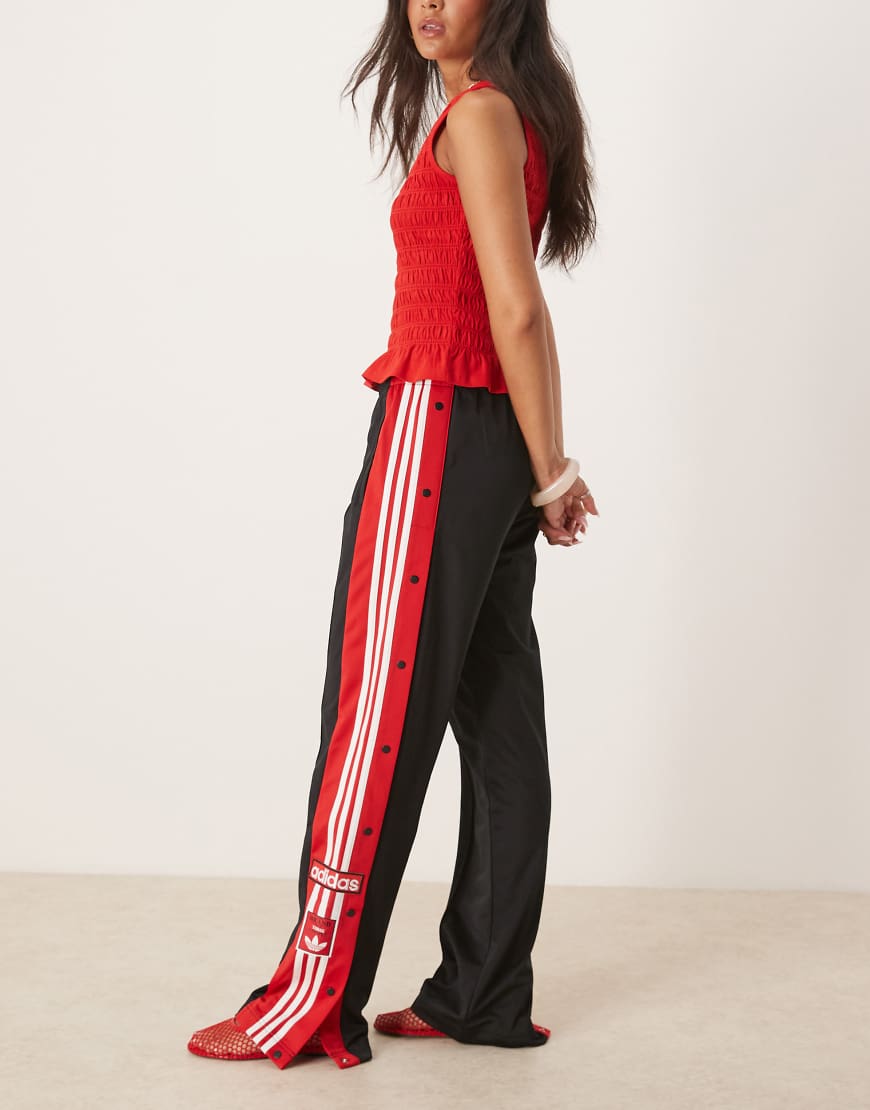 Adibreak track pants in black and red