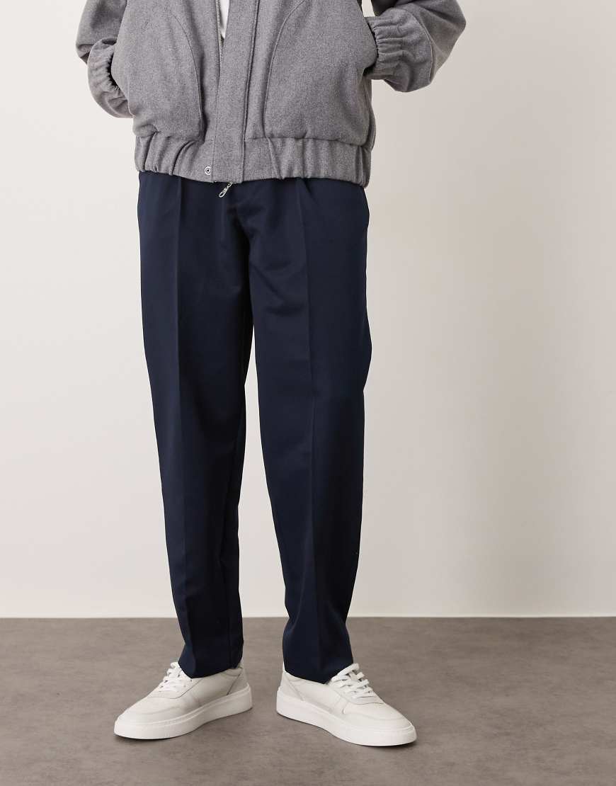 Smart oversized tapered trousers with front pleats in navy