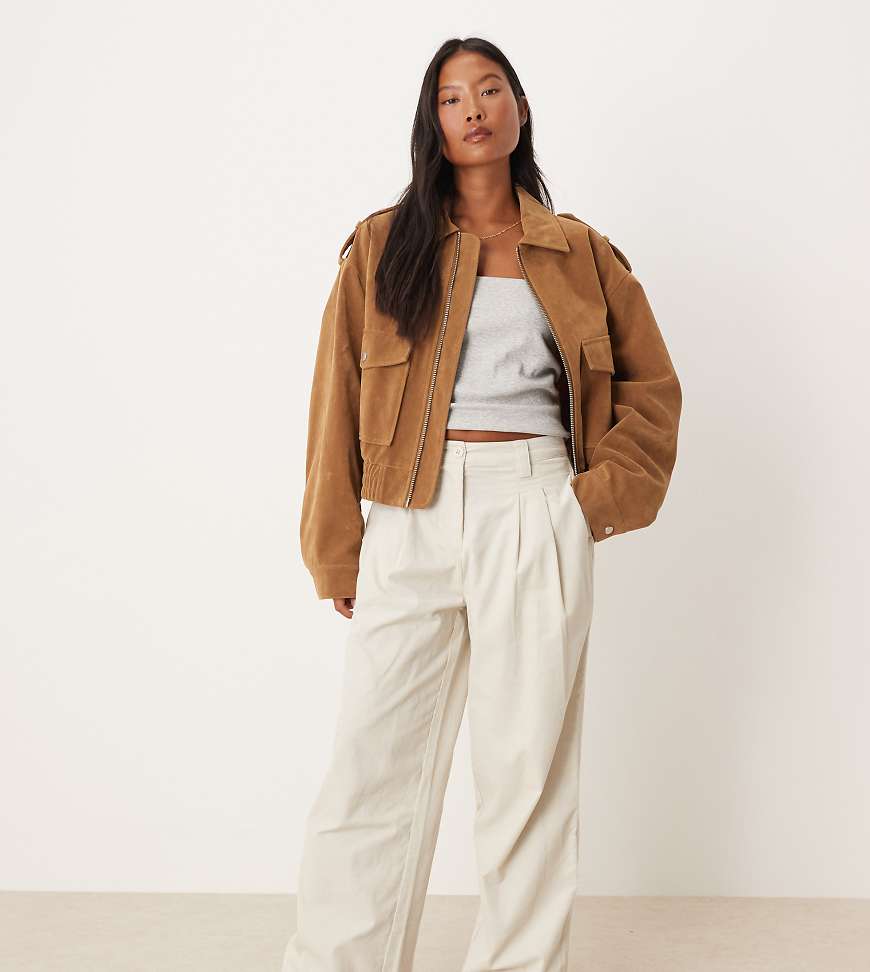 ASOS DESIGN Petite cuffed hem wide leg corduroy pants in cream-White