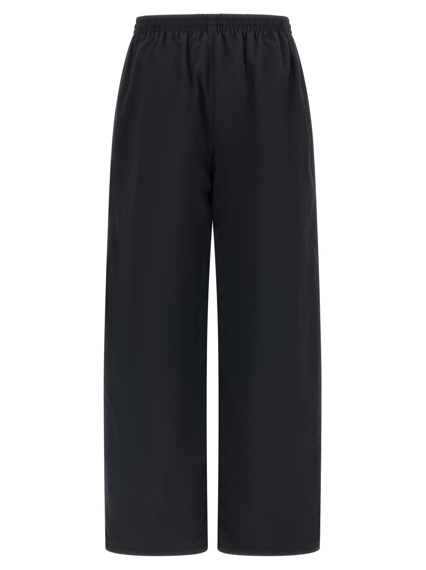 Balenciaga - reversible trousers featuring cursive motif design