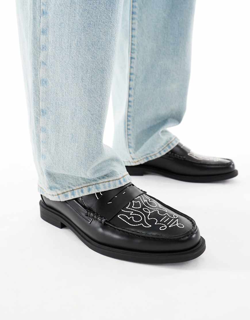 Penny loafers in black with western detailing
