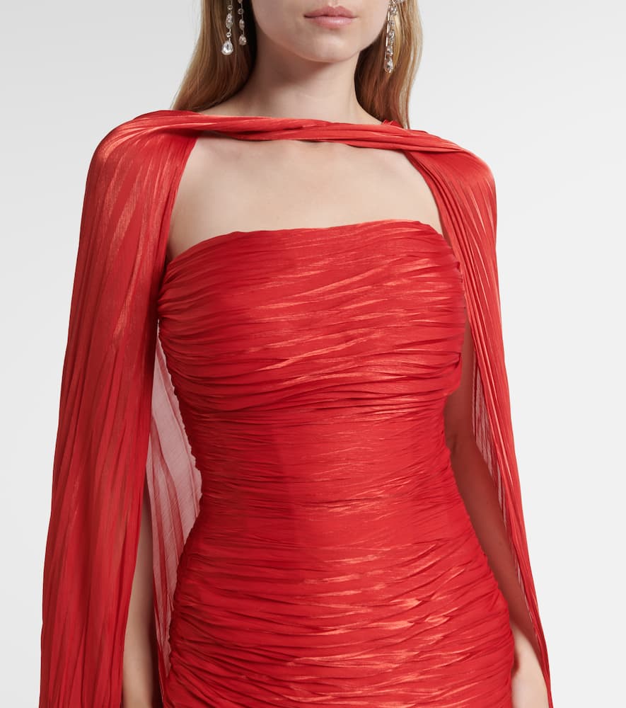 Caped pleated bustier gown