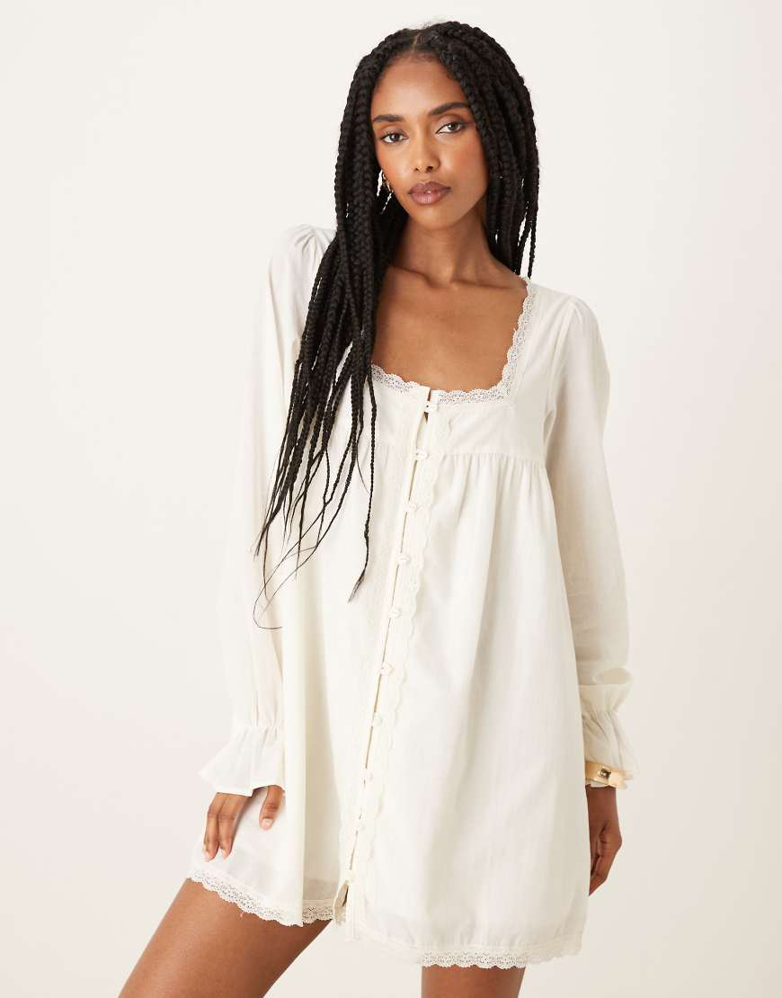Cotton lace trim long sleeve babydoll mini dress in ecru-White