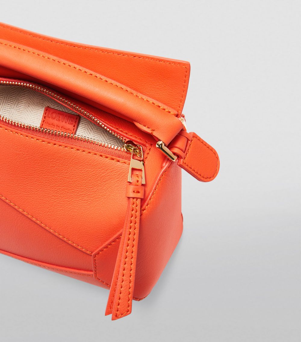 Mini Leather Puzzle Edge Top-Handle Bag