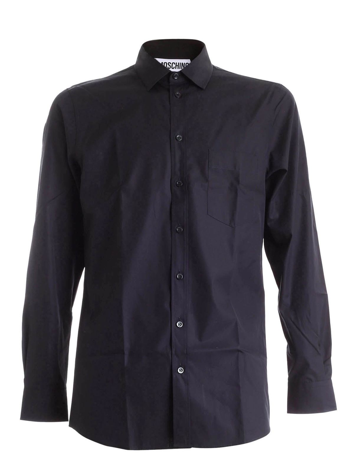 Pins on the collar shirt in black