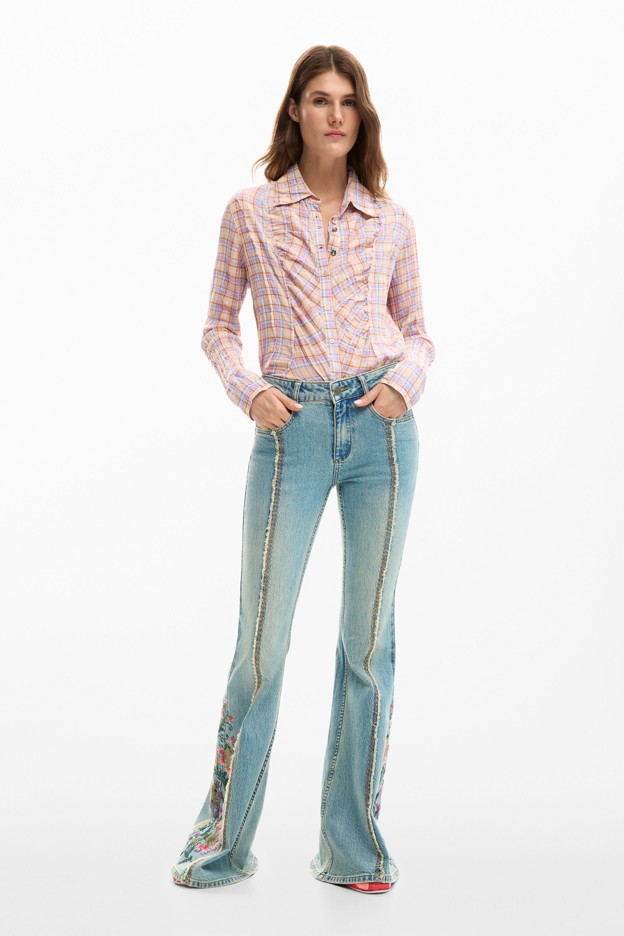 Denim pants with floral stitching