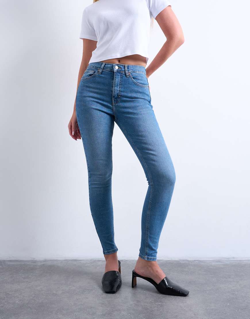 Jamie high rise skinny jean in mid blue