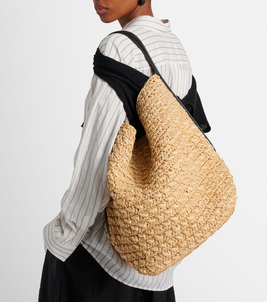 Leather-trimmed raffia and paper bucket bag