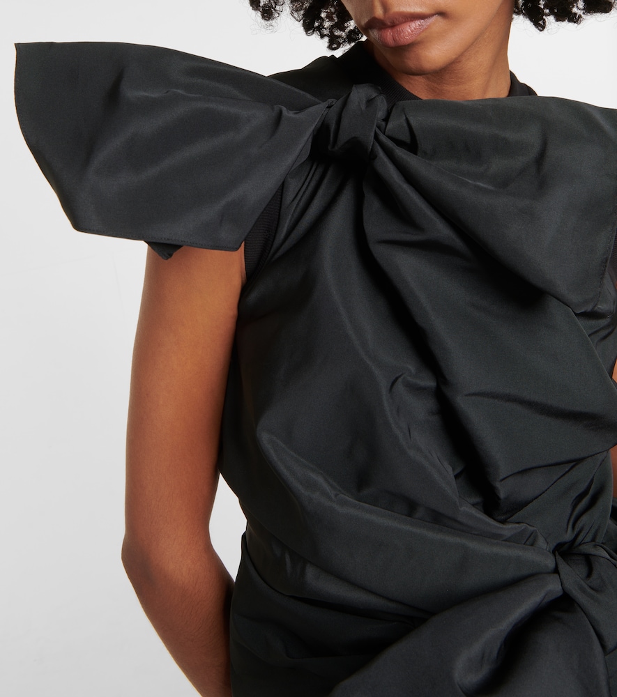 Asymmetric bow-detail top