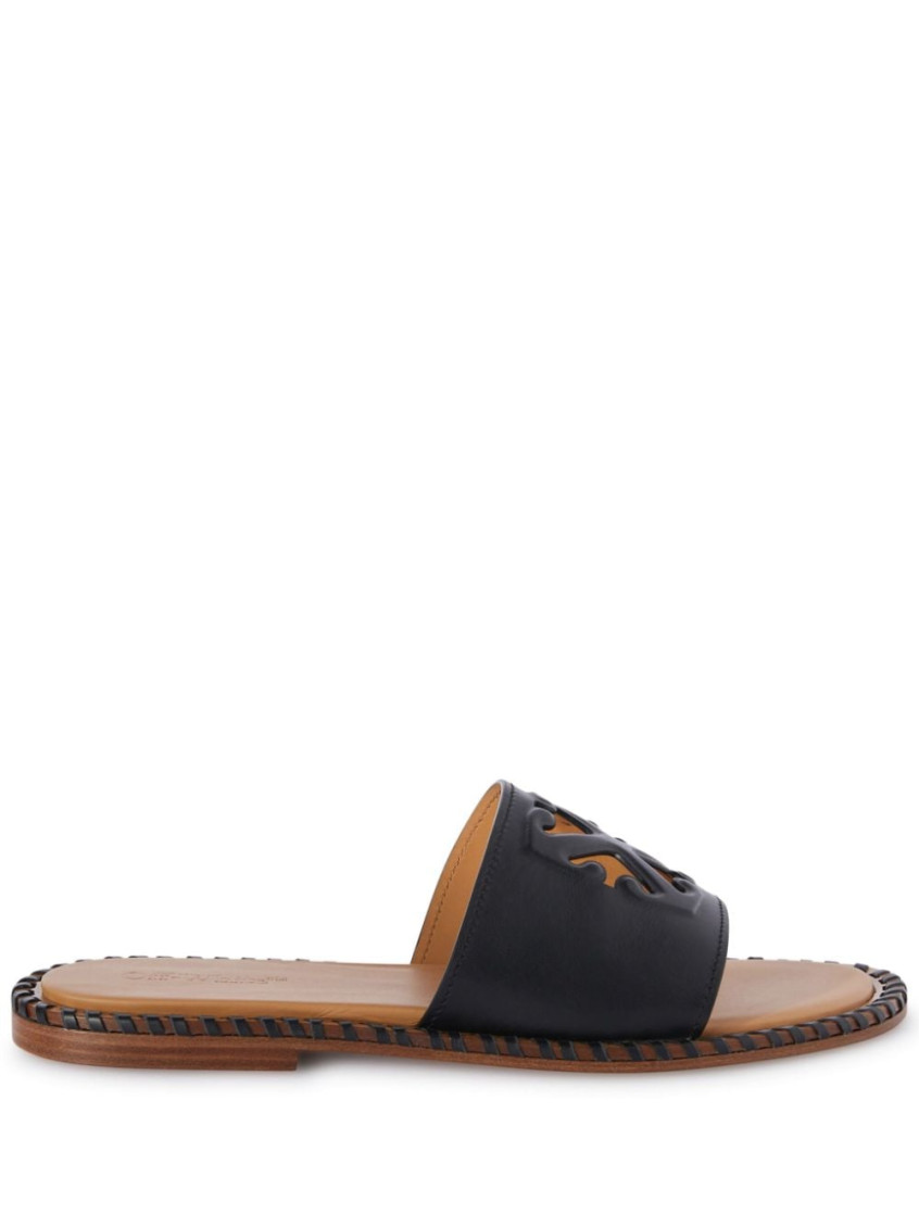 Twist Arrow-embossed leather slides - Black