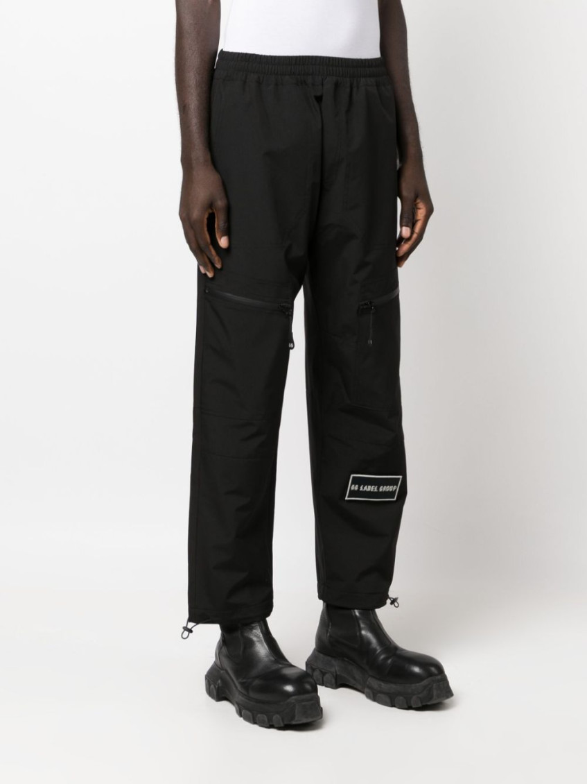Logo-patch straight-leg trousers - Black