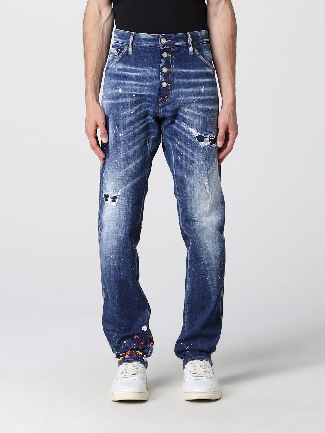 Ripped jeans with applied flowers