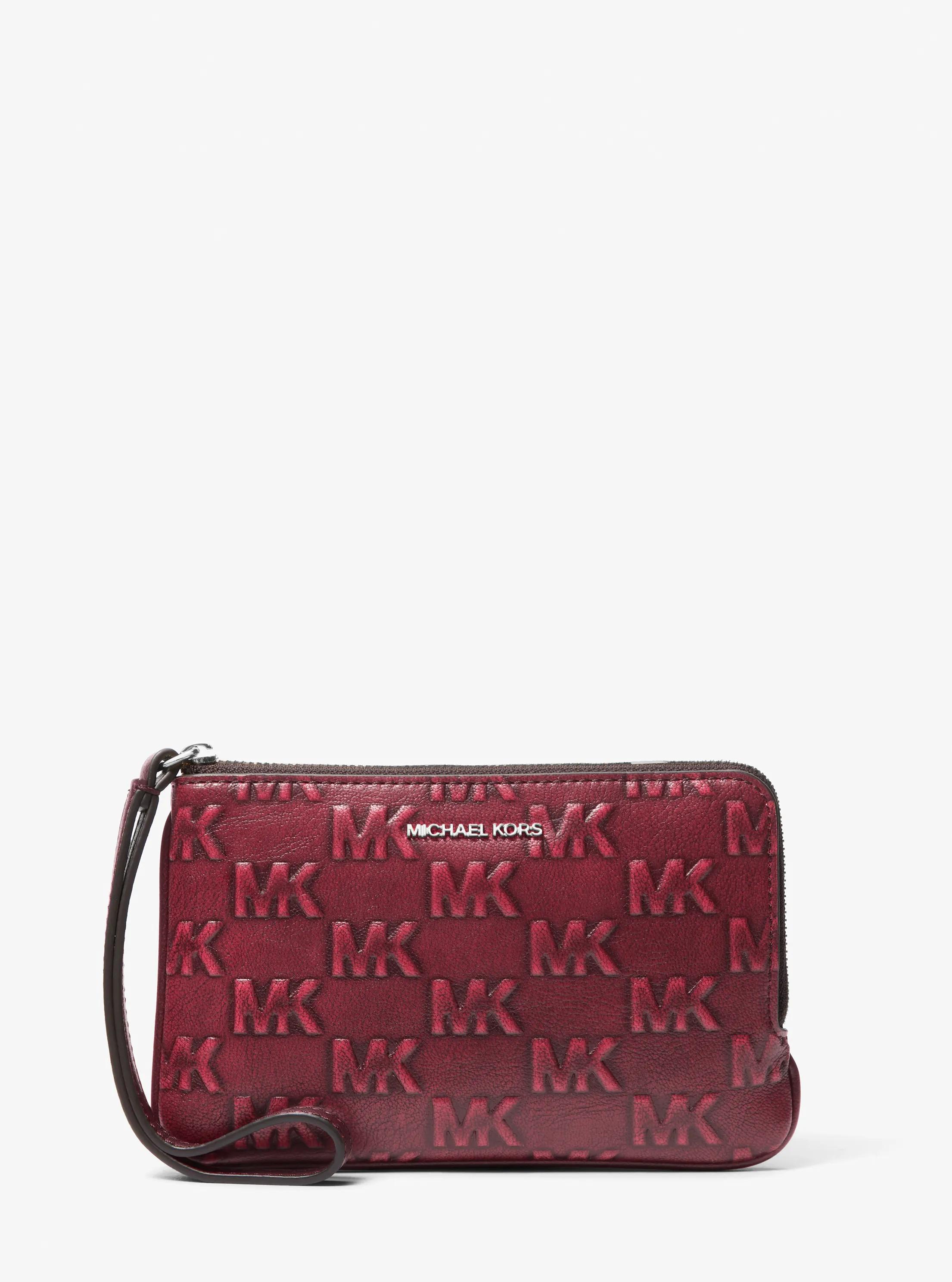 Jet Set Travel Small Burnished Logo Embossed Wristlet in Red - One Size