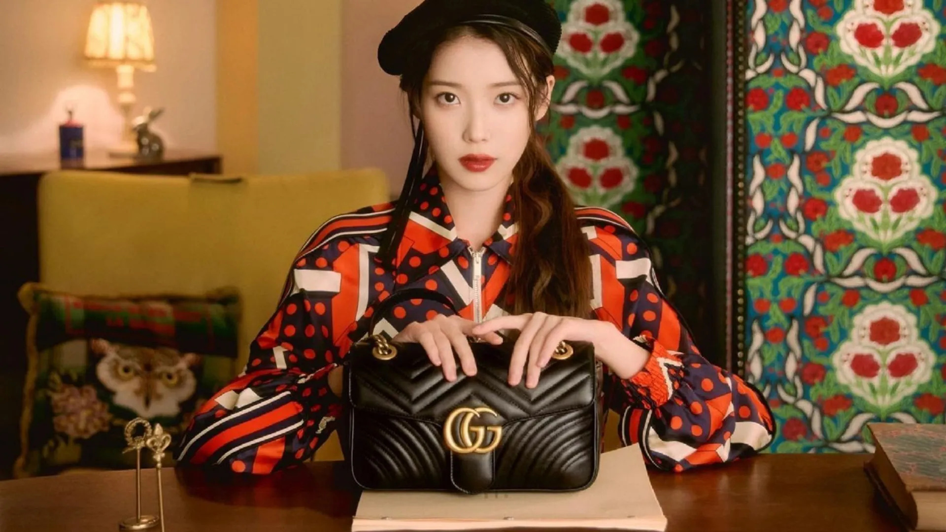 IU holding GG Marmont