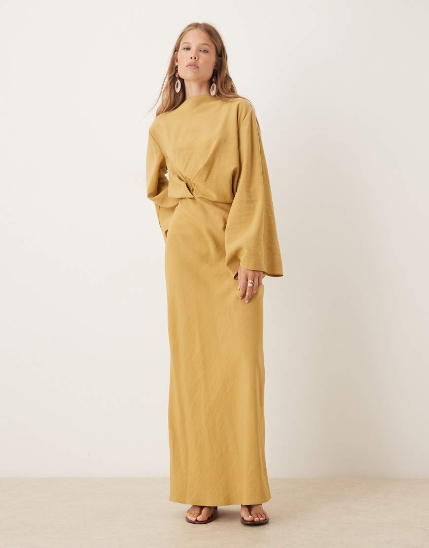 Long sleeve tucked waist bias maxi dress in gold
