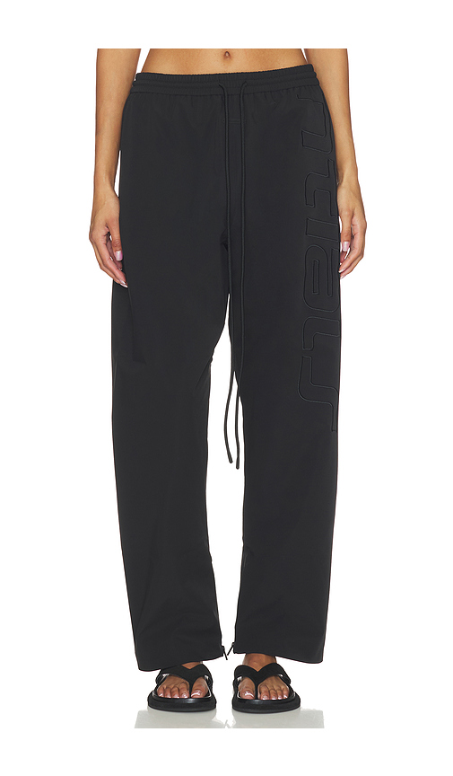 Fear of God ESSENTIALS Active Trace Track Sporty Nylon Pant in Vintage Black - Black. XS also in S, M