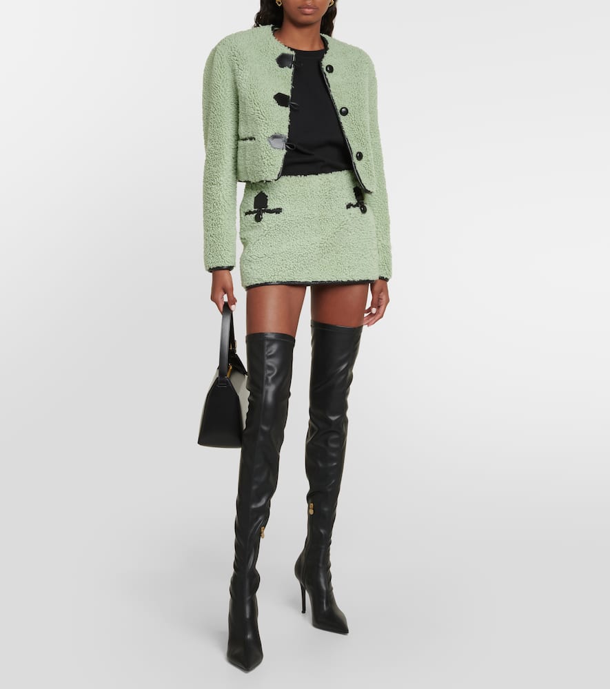 Leather-trimmed shearling miniskirt