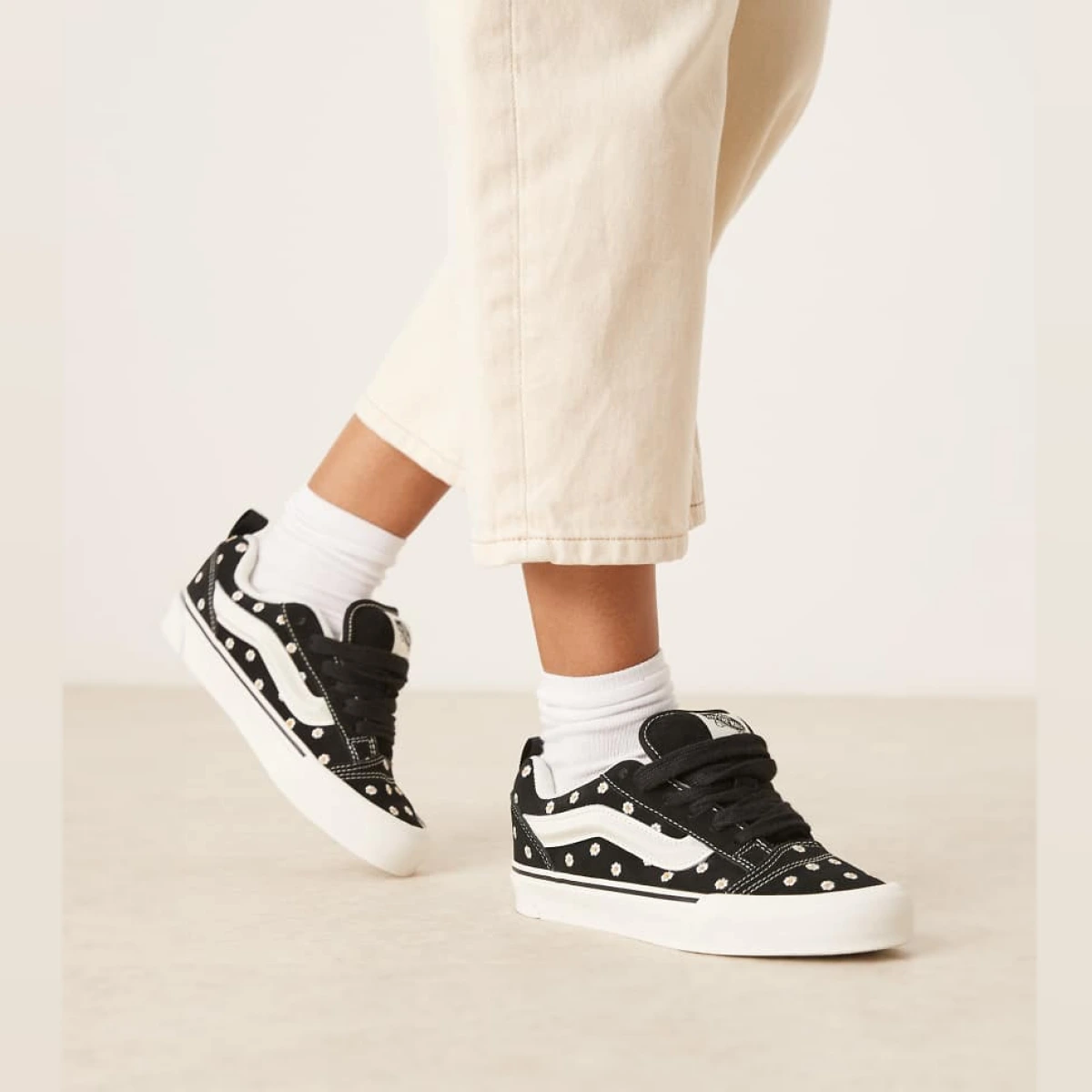 Knu Skool trainers in black with floral embroidery detailing