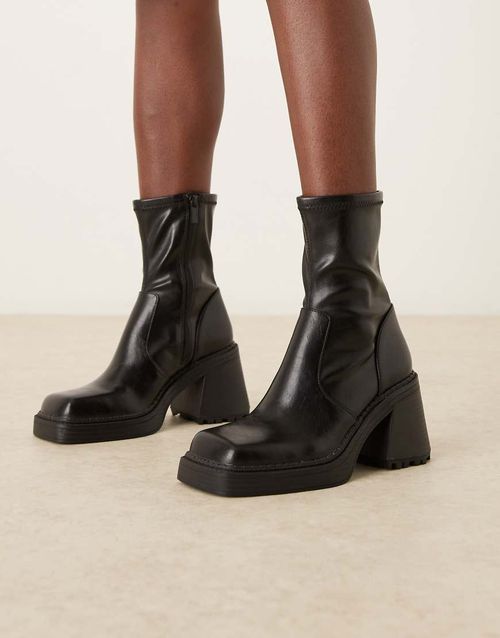 Reign square toe mid-heel platform boots in black