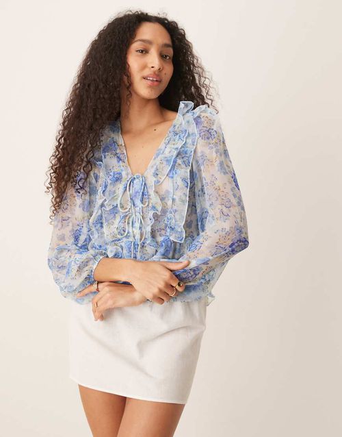 Tie detail long sleeve flouncy floral print blouse with ruffle details in pastel blue