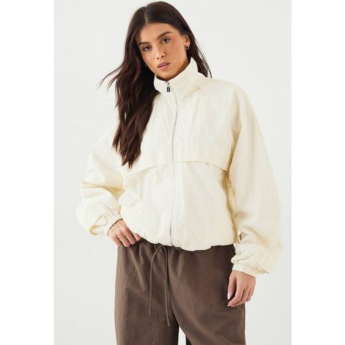 DSGN Studio Women's Nylon Zip Through Funnel Neck Track Jacket in Crea