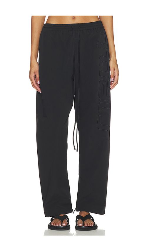Fear of God ESSENTIALS Active Trace Track Sporty Nylon Pant in Vintage Black - Black. XS also in S, M