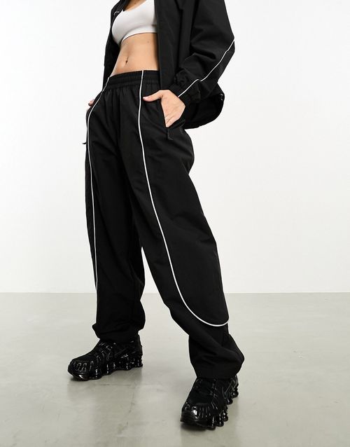 Tek Piping wind pants in black
